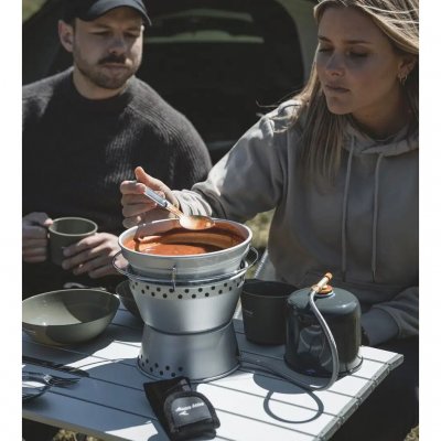 Sikker og effektiv madlavning udendørs, selv når det blæser.